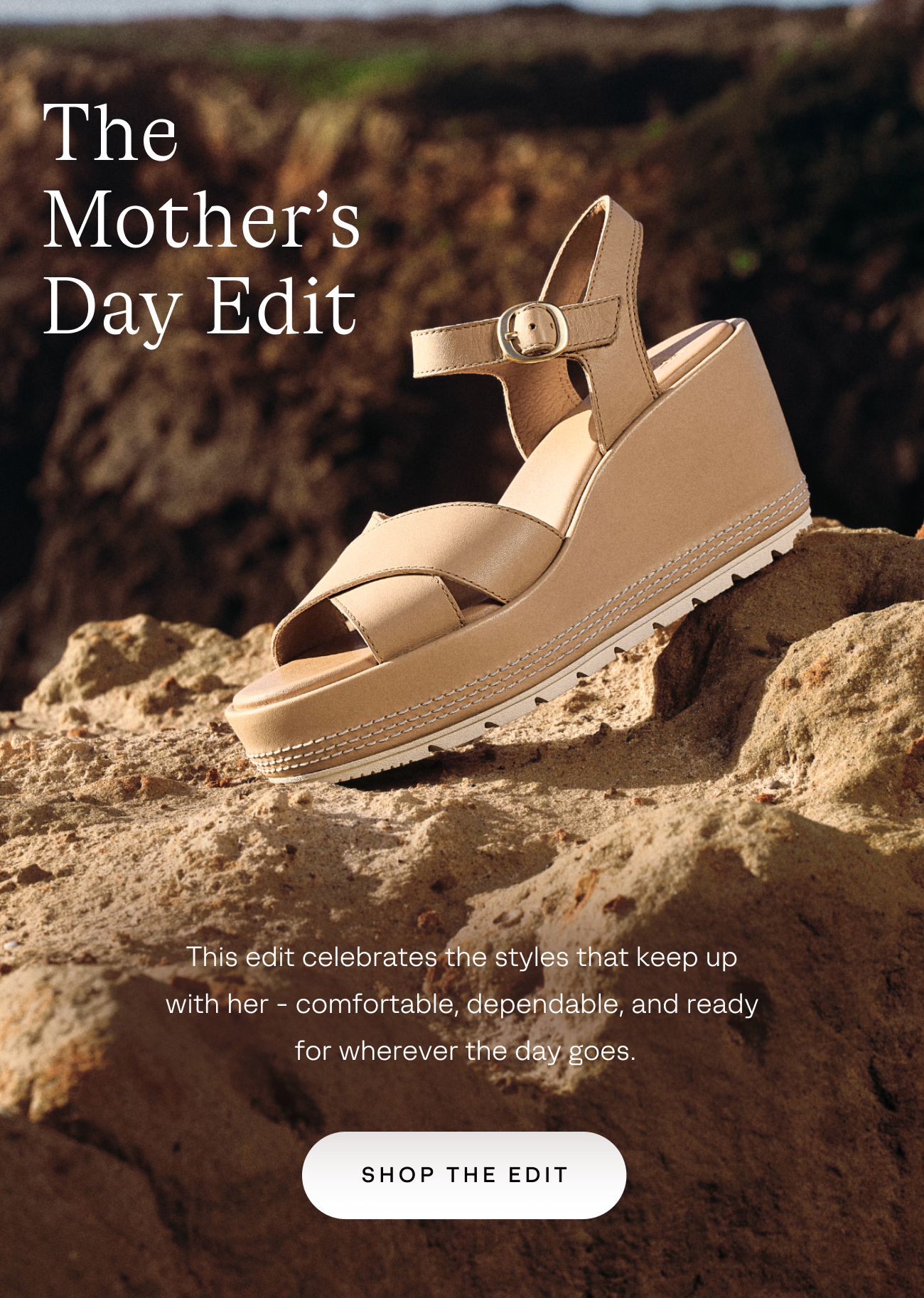 Sandal in beige color sitting on rock ledge with waves behind it