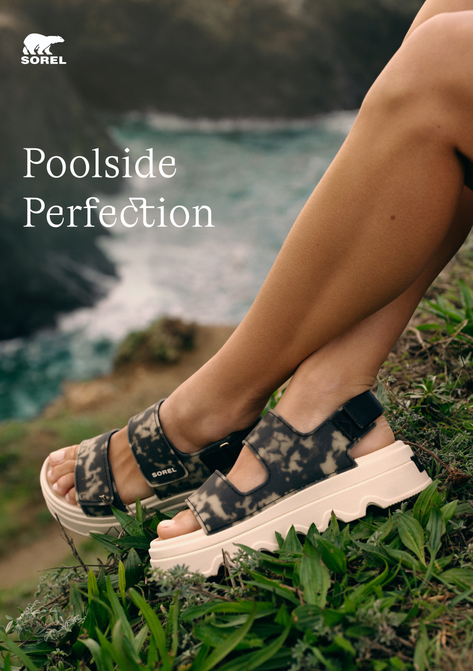 Kinetic™ Sunchase Ankle Strap in Black & Chalk, photographed outside with water